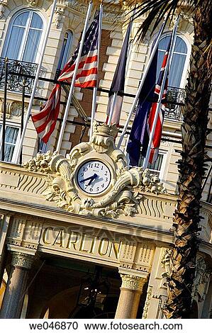 Entrance door, clock and flags of the Carlton Hotel. Cannes. Provence. France View Large Photo Image Stock Image - Entrance door, clock and flags of the Carlton Hotel. Cannes. Provence. France. Fotosearch
