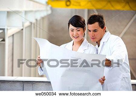 Fatronik Research Centre, San Sebastian Technological Park, Donostia, Gipuzkoa, Basque Country. Technicians looking at blueprints View Large Photo Image Picture - Fatronik Research Centre, San Sebastian Technological Park, Donostia, Gipuzkoa, Basque Country. Technicians looking at blueprints. Fotosearch