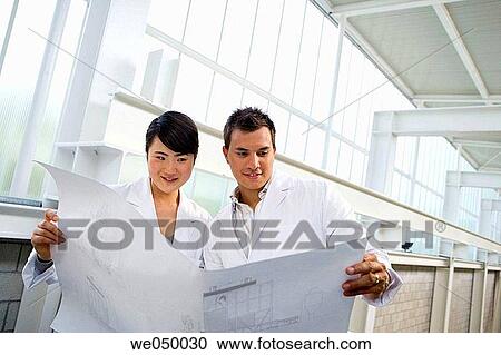 Fatronik Research Centre, San Sebastian Technological Park, Donostia, Gipuzkoa, Basque Country. Technicians looking at blueprints View Large Photo Image Stock Image - Fatronik Research Centre, San Sebastian Technological Park, Donostia, Gipuzkoa, Basque Country. Technicians looking at blueprints. Fotosearch