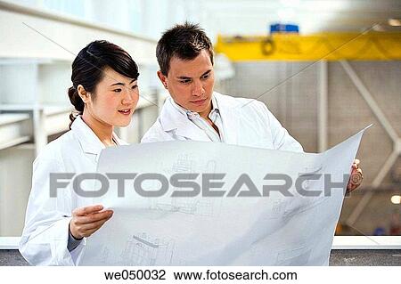 Fatronik Research Centre, San Sebastian Technological Park, Donostia, Gipuzkoa, Basque Country. Technicians looking at blueprints View Large Photo Image Stock Image - Fatronik Research Centre, San Sebastian Technological Park, Donostia, Gipuzkoa, Basque Country. Technicians looking at blueprints. Fotosearch