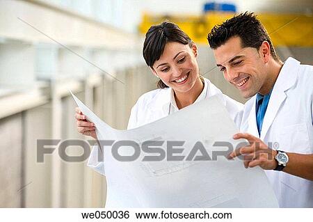 Fatronik Research Centre, San Sebastian Technological Park, Donostia, Gipuzkoa, Basque Country. Technicians looking at blueprints View Large Photo Image Stock Photograph - Fatronik Research Centre, San Sebastian Technological Park, Donostia, Gipuzkoa, Basque Country. Technicians looking at blueprints. Fotosearch