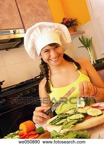 GIRL IN KITCHEN. GIRL COOKING. View Large Photo Image Stock Image - GIRL IN KITCHEN. GIRL COOKING.. Fotosearch