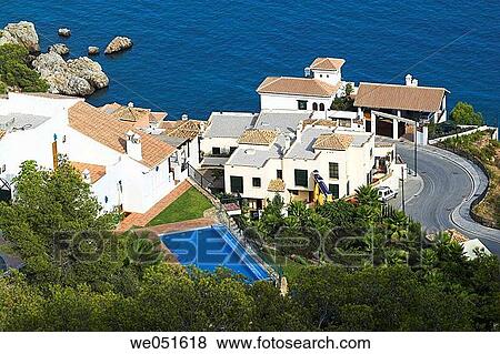 Housing development by the sea. Costa del Sol, Mßlaga province, Andalusia, Spain View Large Photo Image Stock Photo - Housing development by the sea. Costa del Sol, Mßlaga province, Andalusia, Spain. Fotosearch