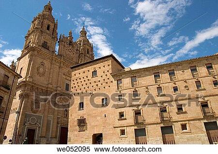 Stock Photography - La Clerec? a (18ht century baroque Jesuit monastery) and Casa de las Conchas (16th century) on the right, Salamanca. Castilla-Le? n, Spain. Fotosearch