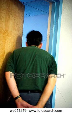 Man standing in a doorway, looking into an office View Large Photo Image Stock Photograph - Man standing in a doorway, looking into an office. Fotosearch