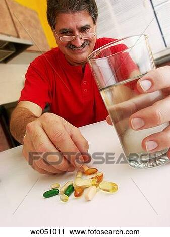 Man taking pills. View Large Photo Image Stock Image - Man taking pills.. Fotosearch