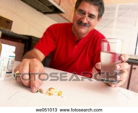 Man taking pills. View Large Photo Image Stock Image - Man taking pills.. Fotosearch