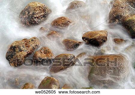 Stock Photography - Ocean waves and rocks. Santa Cruz beach. Madeira. Portugal.. Fotosearch