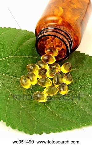Stock Image - Pearls with vegetal extracts.. Fotosearch