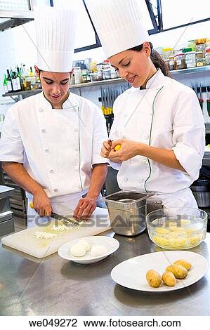 Peeling potatoes, chopping boiled eggs. Luis Irizar cooking school. Donostia, Gipuzkoa, Basque Country, Spain View Large Photo Image Stock Image - Peeling potatoes, chopping boiled eggs. Luis Irizar cooking school. Donostia, Gipuzkoa, Basque Country, Spain. Fotosearch