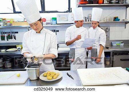 Peeling potatoes. Luis Irizar cooking school. Donostia, Gipuzkoa, Basque Country, Spain View Large Photo Image Stock Photo - Peeling potatoes. Luis Irizar cooking school. Donostia, Gipuzkoa, Basque Country, Spain. Fotosearch