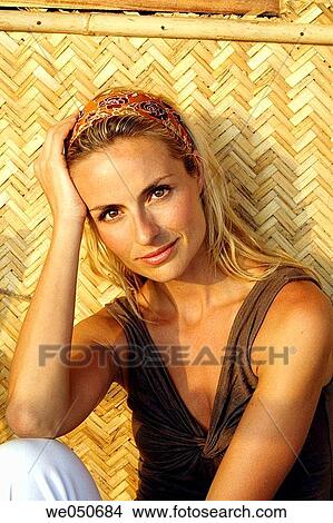 Portrait of beautiful blonde woman shot in an Indian beach hut. View Large Photo Image Picture - Portrait of beautiful blonde woman shot in an Indian beach hut.. Fotosearch