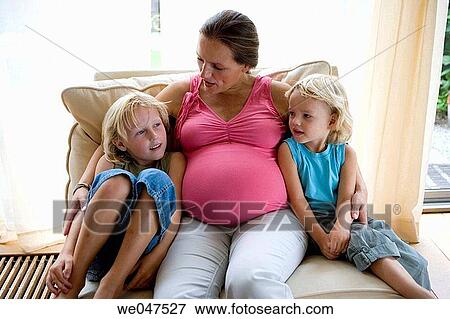 Pregnant mother with two sons View Large Photo Image Stock Photo - Pregnant mother with two sons. Fotosearch