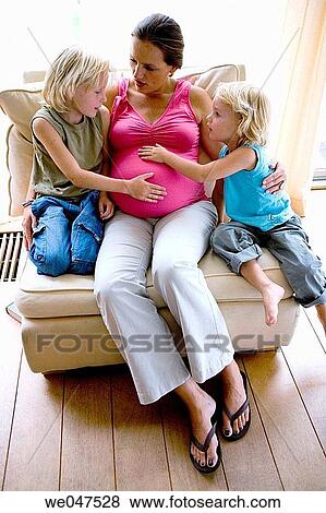 Pregnant mother with two sons View Large Photo Image Stock Photo - Pregnant mother with two sons. Fotosearch