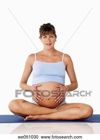 Pregnant woman exercising View Large Photo Image Stock Image - Pregnant woman exercising. Fotosearch