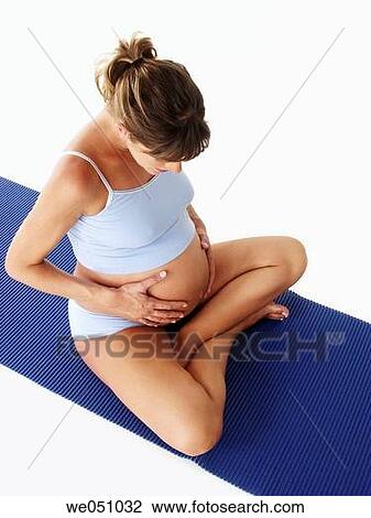 Pregnant woman exercising View Large Photo Image Stock Image - Pregnant woman exercising. Fotosearch
