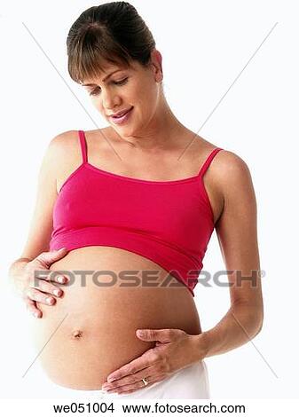 Pregnant woman in white background View Large Photo Image Picture - Pregnant woman in white background. Fotosearch