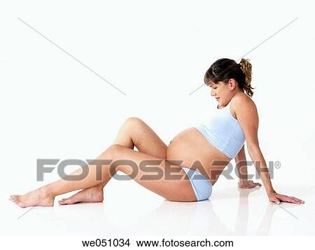 Pregnant woman in white background View Large Photo Image Picture - Pregnant woman in white background. Fotosearch