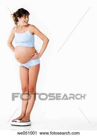 Pregnant woman in white background View Large Photo Image Stock Image - Pregnant woman in white background. Fotosearch