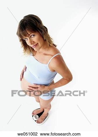 Pregnant woman in white background View Large Photo Image Stock Image - Pregnant woman in white background. Fotosearch