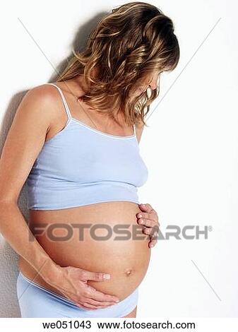 Pregnant woman in white background View Large Photo Image Stock Image - Pregnant woman in white background. Fotosearch