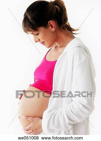 Stock Photo - Pregnant woman in white background. Fotosearch