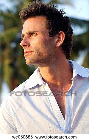 Profile shot of good-looking man with palm trees in background. View Large Photo Image Stock Photography - Profile shot of good-looking man with palm trees in background.. Fotosearch