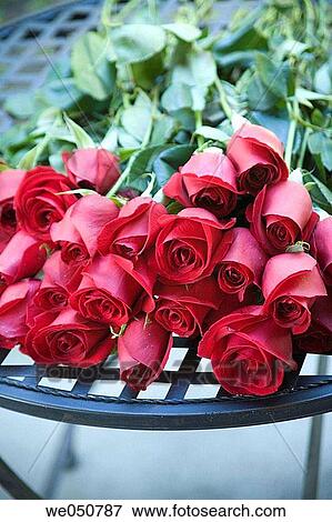 Red roses on bistro table View Large Photo Image Stock Photo - Red roses on bistro table. Fotosearch