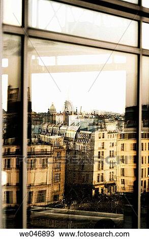 Stock Image - Reflections on window of Eiffel Tower and Paris skyline. Paris. France. Fotosearch