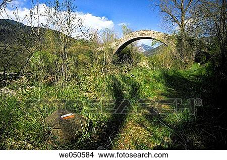 Romanesque bridge (11th century) over stream, Oix. Garrotxa, Girona province, Catalonia, Spain View Large Photo Image Picture - Romanesque bridge (11th century) over stream, Oix. Garrotxa, Girona province, Catalonia, Spain. Fotosearch