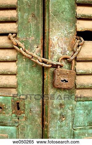 Rusty padlock hung on a door, Hoi An, Vietnam, South East Asia View Large Photo Image Stock Photography - Rusty padlock hung on a door, Hoi An, Vietnam, South East Asia. Fotosearch
