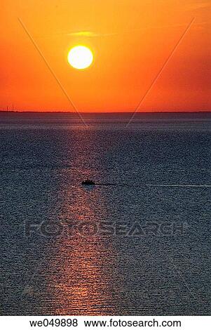 Sailing in to the sunset on a summerday. Limfjorden, Jutland, Denmark View Large Photo Image Stock Photo - Sailing in to the sunset on a summerday. Limfjorden, Jutland, Denmark. Fotosearch