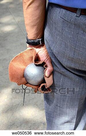 Senior man holding boule View Large Photo Image Stock Photograph - Senior man holding boule. Fotosearch