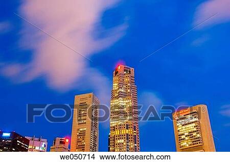 Singapore, office buildings by Singapore River at night, moving clouds View Large Photo Image Picture - Singapore, office buildings by Singapore River at night, moving clouds. Fotosearch