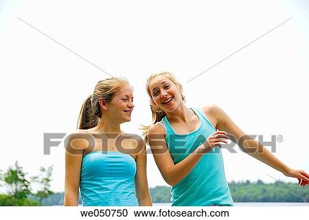 sisters 18 and 13 yrs laughing and playing at cottage View Large Photo Image Stock Image - sisters 18 and 13 yrs laughing and playing at cottage. Fotosearch