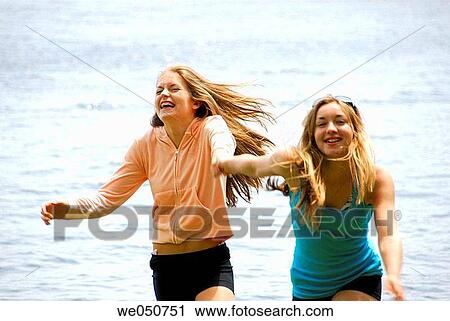sisters 18 and 13 yrs playing at cottage, vacation View Large Photo Image Stock Image - sisters 18 and 13 yrs playing at cottage, vacation. Fotosearch