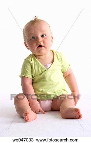 Stock Image - Sitting baby girl. Fotosearch