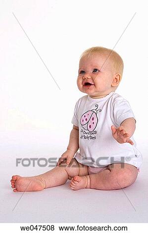 Stock Photo - Sitting baby. Fotosearch