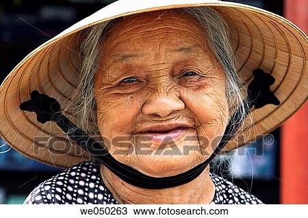 Smiling old lady, Hoi An, Vietnam, South East Asia View Large Photo Image Stock Image - Smiling old lady, Hoi An, Vietnam, South East Asia. Fotosearch