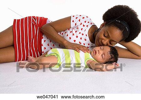 Teenage mother and sleeping baby View Large Photo Image Stock Image - Teenage mother and sleeping baby. Fotosearch