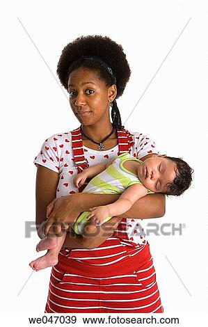 Teenage mother and sleeping baby View Large Photo Image Stock Photo - Teenage mother and sleeping baby. Fotosearch