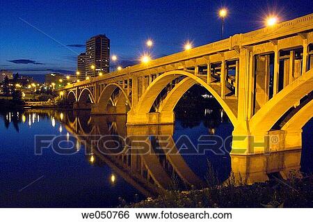 The Saskatoon, Canada skyline with the Broadway Bridge over the South Saskatchewan River at dusk. View Large Photo Image Stock Photograph - The Saskatoon, Canada skyline with the Broadway Bridge over the South Saskatchewan River at dusk.. Fotosearch