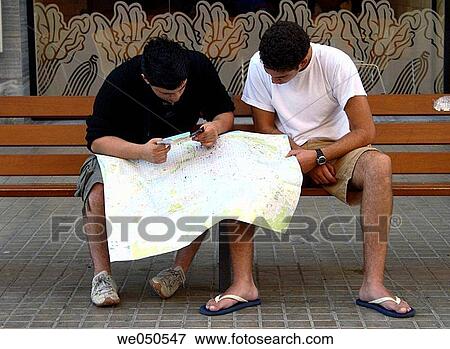 Tourists looking at map, Barcelona. Catalonia, Spain View Large Photo Image Stock Photo - Tourists looking at map, Barcelona. Catalonia, Spain. Fotosearch