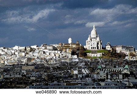 Stock Image - View of Paris rooftops with Sacr? Coeur Church in the background. Paris. France. Fotosearch