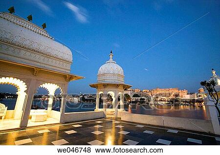 View of the city from the Lake Palace Hotel on Lake Pichola at night. Udaipur. Rajasthan. India. View Large Photo Image Stock Photo - View of the city from the Lake Palace Hotel on Lake Pichola at night. Udaipur. Rajasthan. India.. Fotosearch