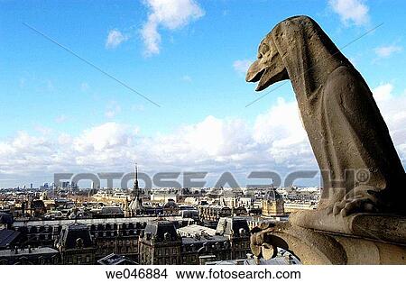 View of the rooftops and gargoyle from the top of Notre Dame Cathedral. Paris. France View Large Photo Image Picture - View of the rooftops and gargoyle from the top of Notre Dame Cathedral. Paris. France. Fotosearch