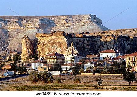 Village with backdrop of rock formations.? avusin. Cappadocia. Turkey. View Large Photo Image Stock Photograph - Village with backdrop of rock formations.? avusin. Cappadocia. Turkey.. Fotosearch