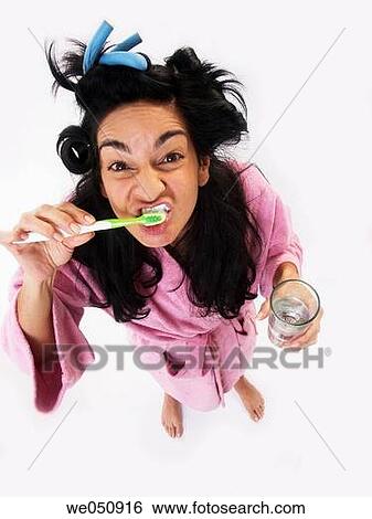 woman brushing her teeth View Large Photo Image Stock Photograph - woman brushing her teeth. Fotosearch