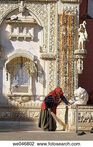 Woman dusting outside the Karni Mata Rat Temple. Deshnok. Rajasthan. India. View Large Photo Image Stock Image - Woman dusting outside the Karni Mata Rat Temple. Deshnok. Rajasthan. India.. Fotosearch