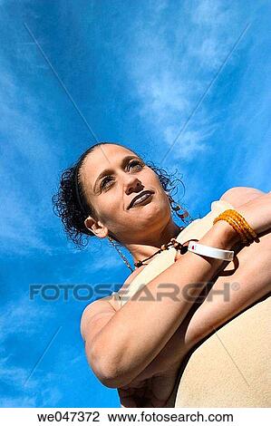 Young Hispanic woman, eight months pregnant, posing with crossed arms View Large Photo Image Stock Image - Young Hispanic woman, eight months pregnant, posing with crossed arms. Fotosearch